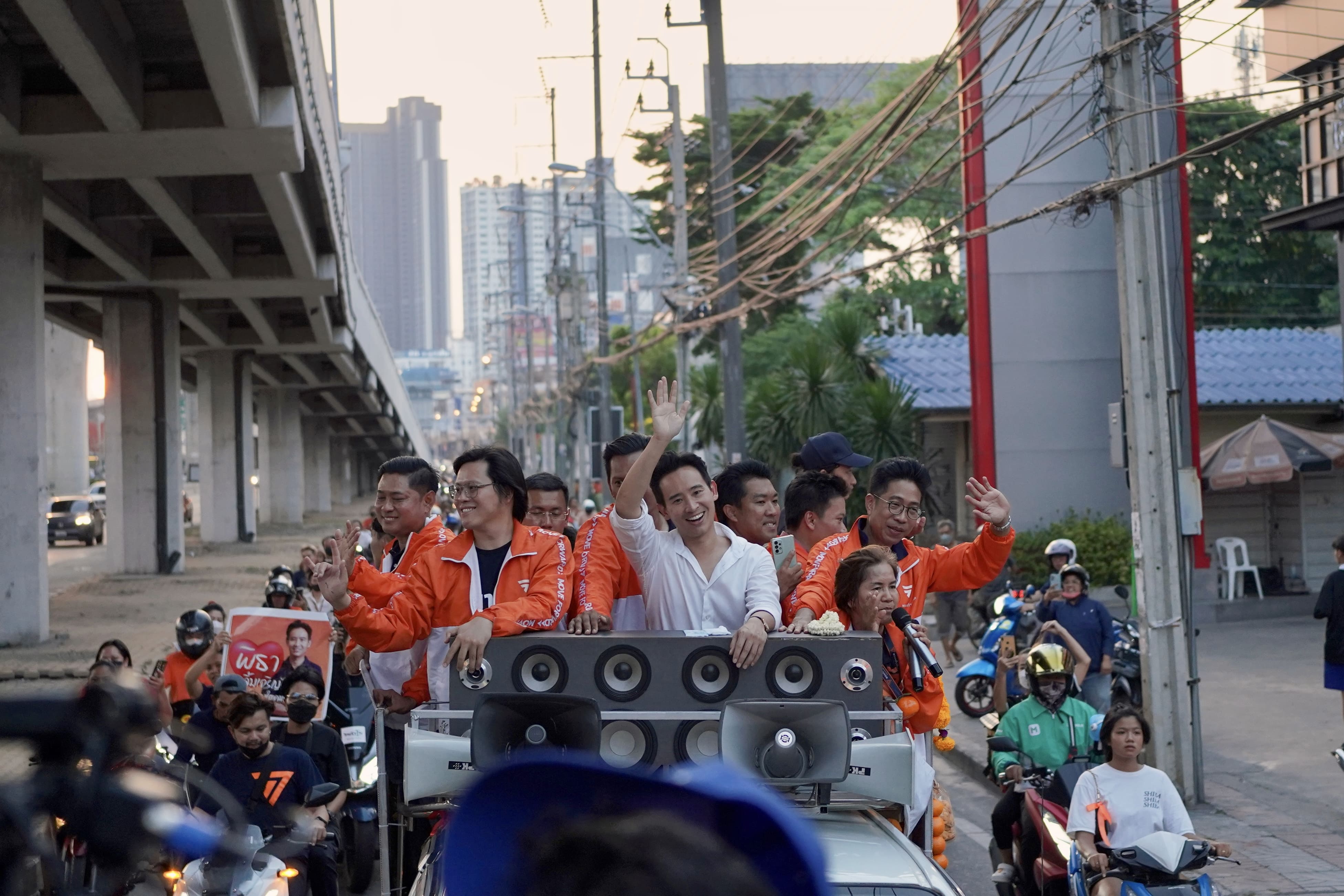 Move Forward Party leader and prime ministerial candidate Pita Limjaroenrat leads a victory parade with fellow party members and supporters outside Bangkok City Hall on May 15, 2023